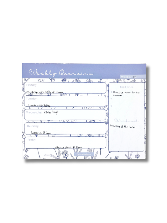 Weekly overview planner with floral design on a white background