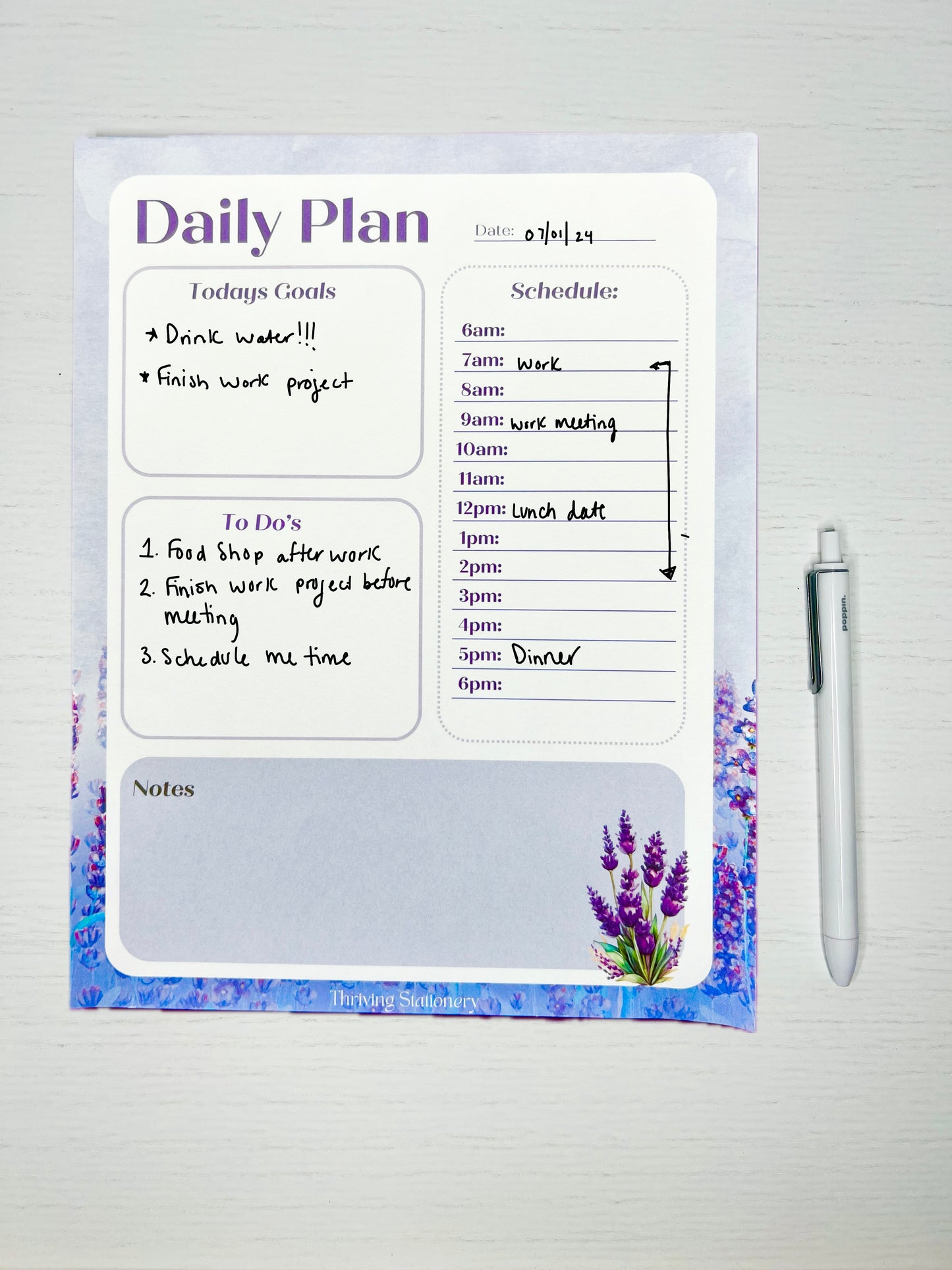 Close-up of lavender daily planner time-stamped hourly schedule