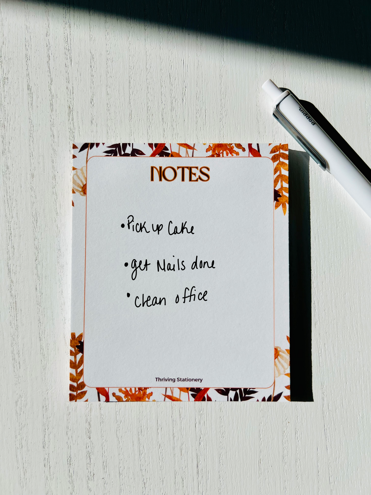 Blank tear-away pages of fall stationery notepad