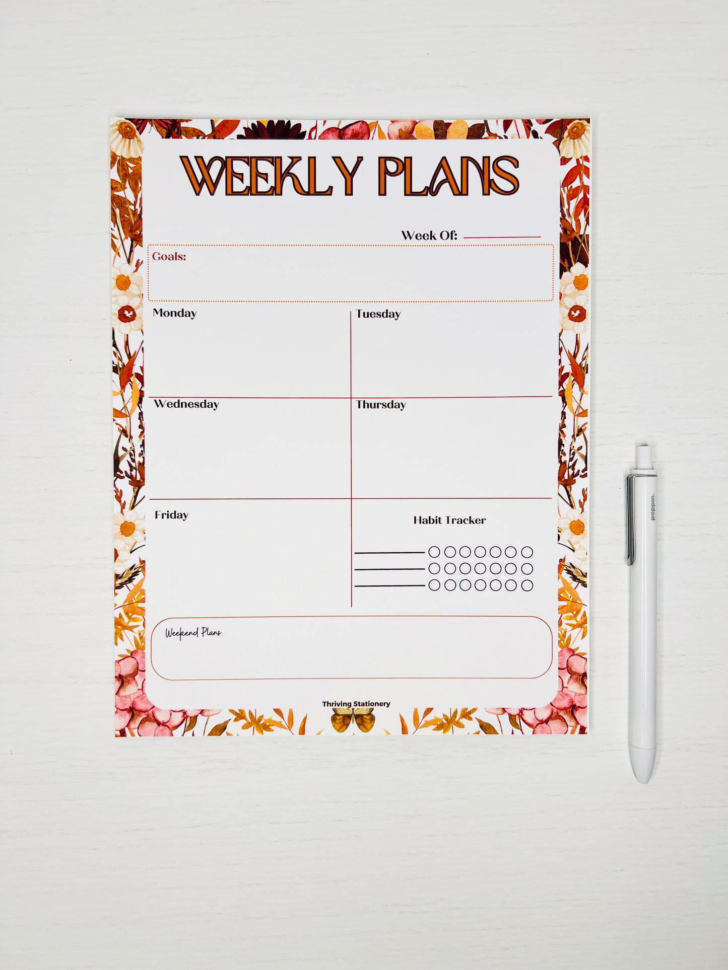 A weekly planner notepad with a fall foliage design, featuring sections for weekly planning, daily tasks, and notes.