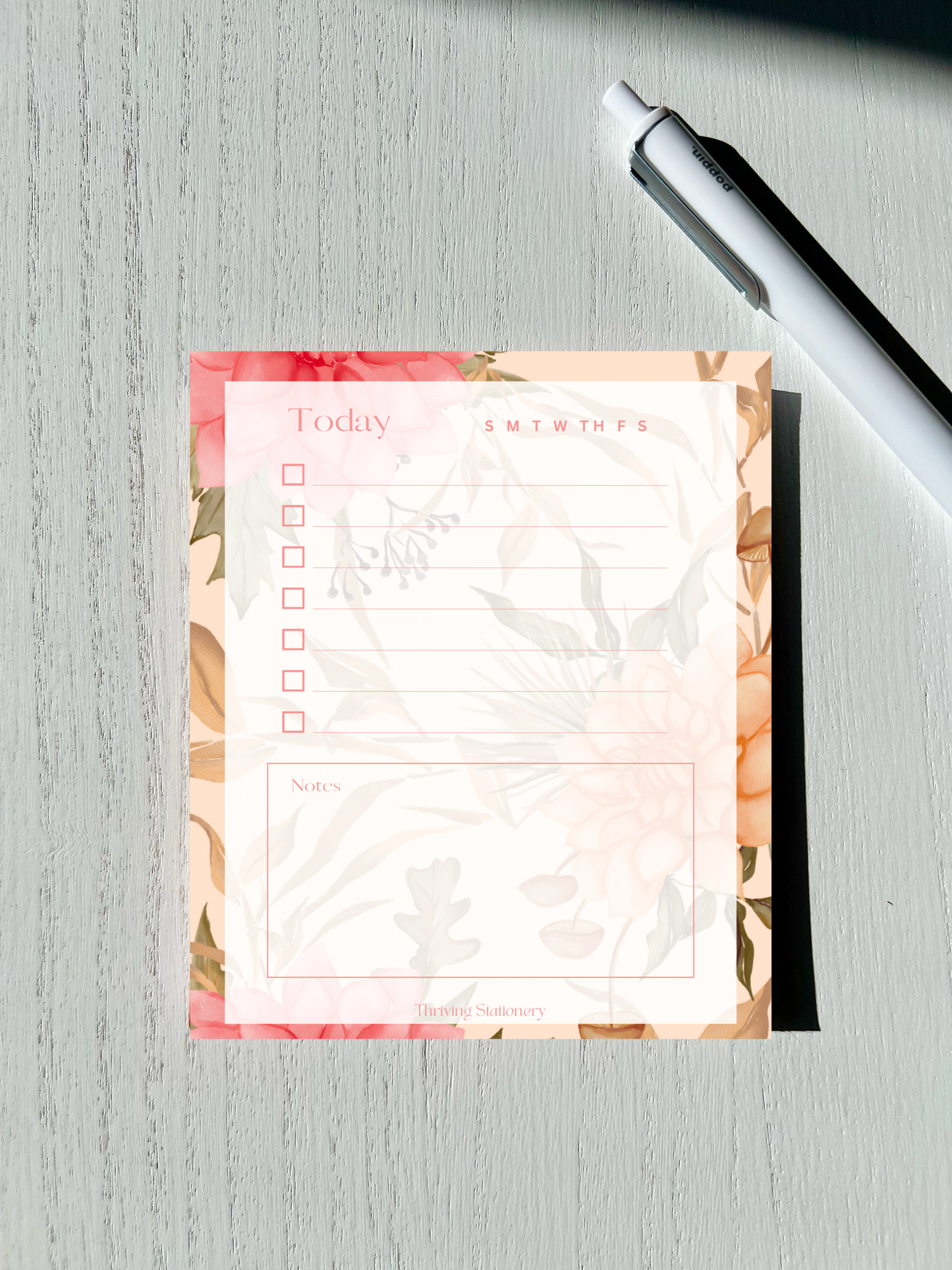 Feminine floral daily notepad with pink flower background, five checklist items, weekday tracker, and notes section on 50 tear-away sheets.