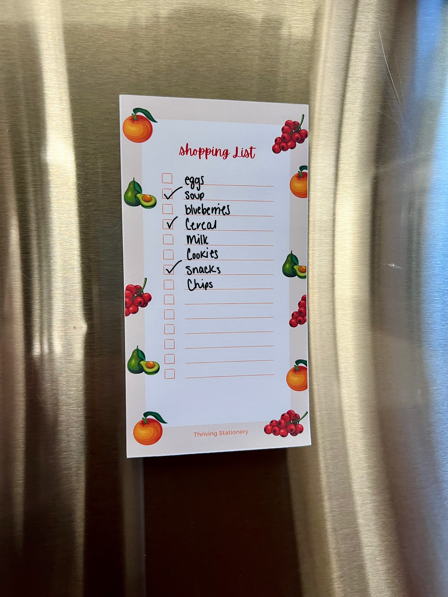 Fruit-themed magnetic shopping list notepad with oranges, pears, and berries, red checkboxes and tear-away sheets for groceries or to-dos.