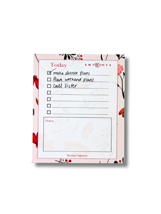 Pink Botanical Daily Planner Notepad with floral border, to-do list, and notes section with writing