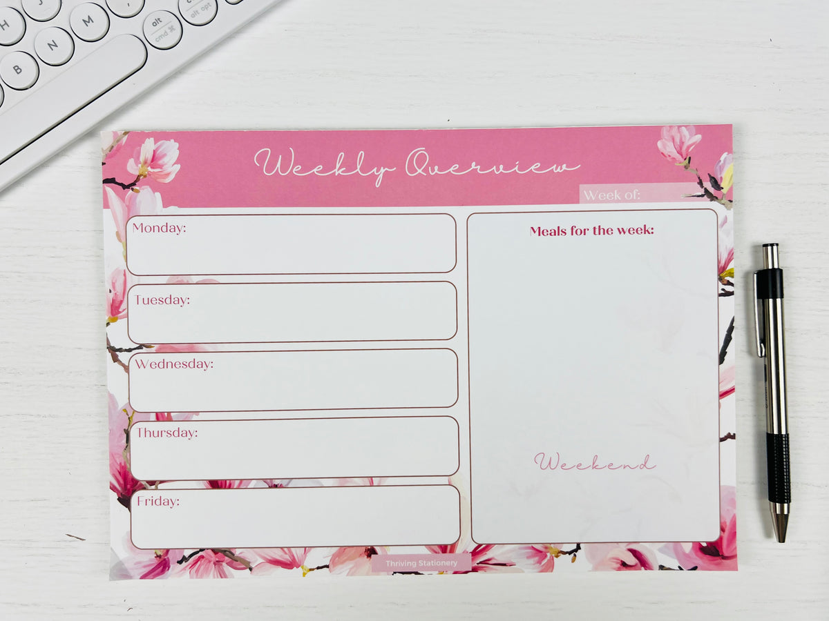 Pink Cherry Blossom Weekly Planner Deskpad with light floral design and weekly layout