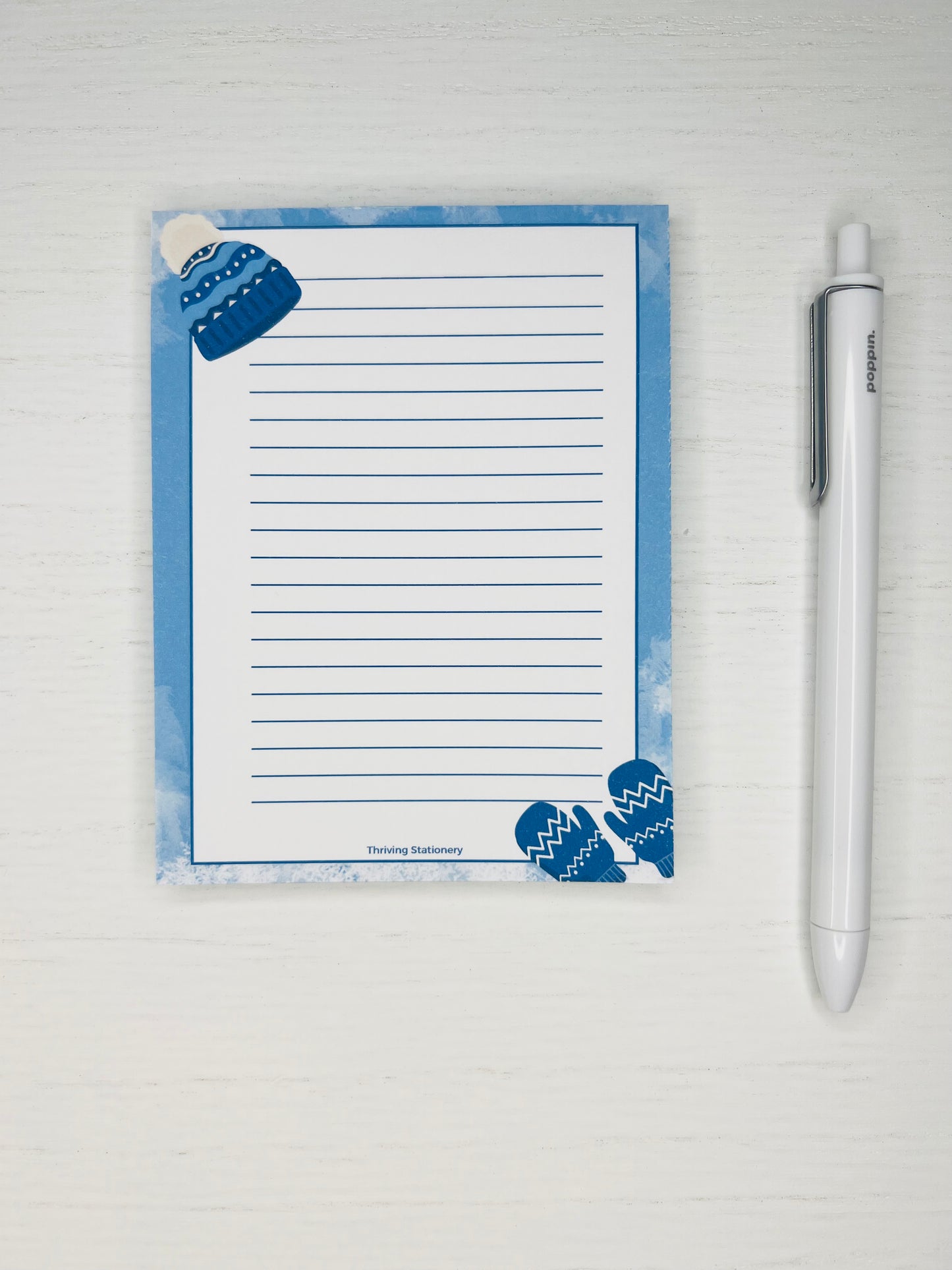 Holiday notepad with lined pages and frosty winter design