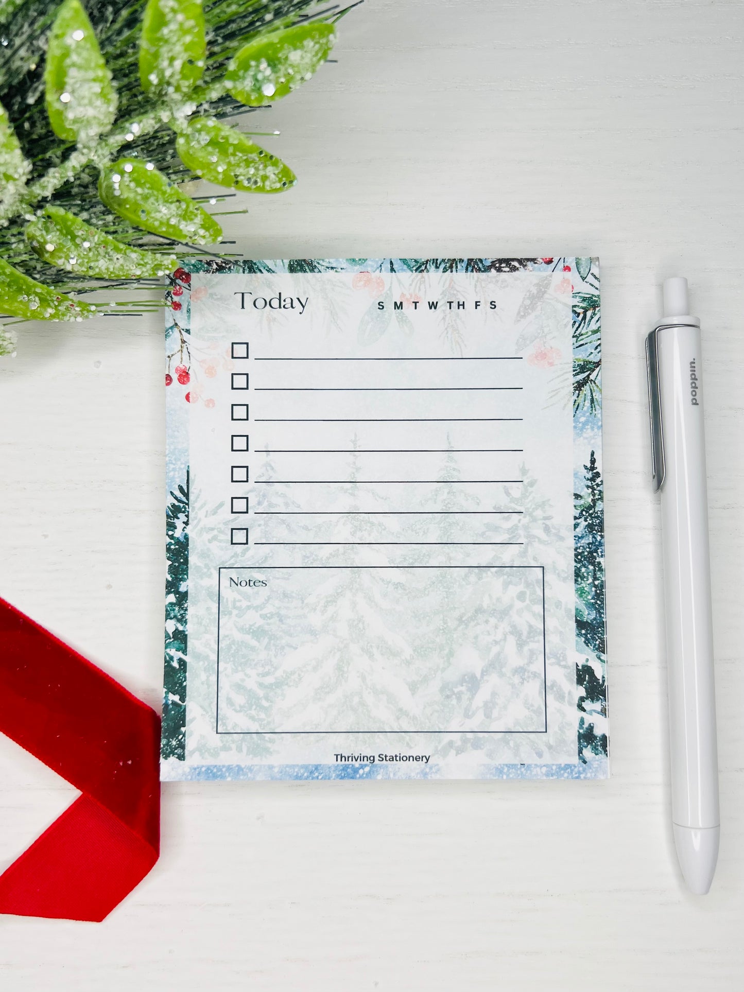 A to-do list with a winter design, featuring frost-kissed tree illustrations and the title 'TODAY' at the top, along with a check box next to each page line.