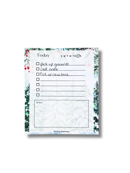 Notepad with a to-do list and floral border on a white background