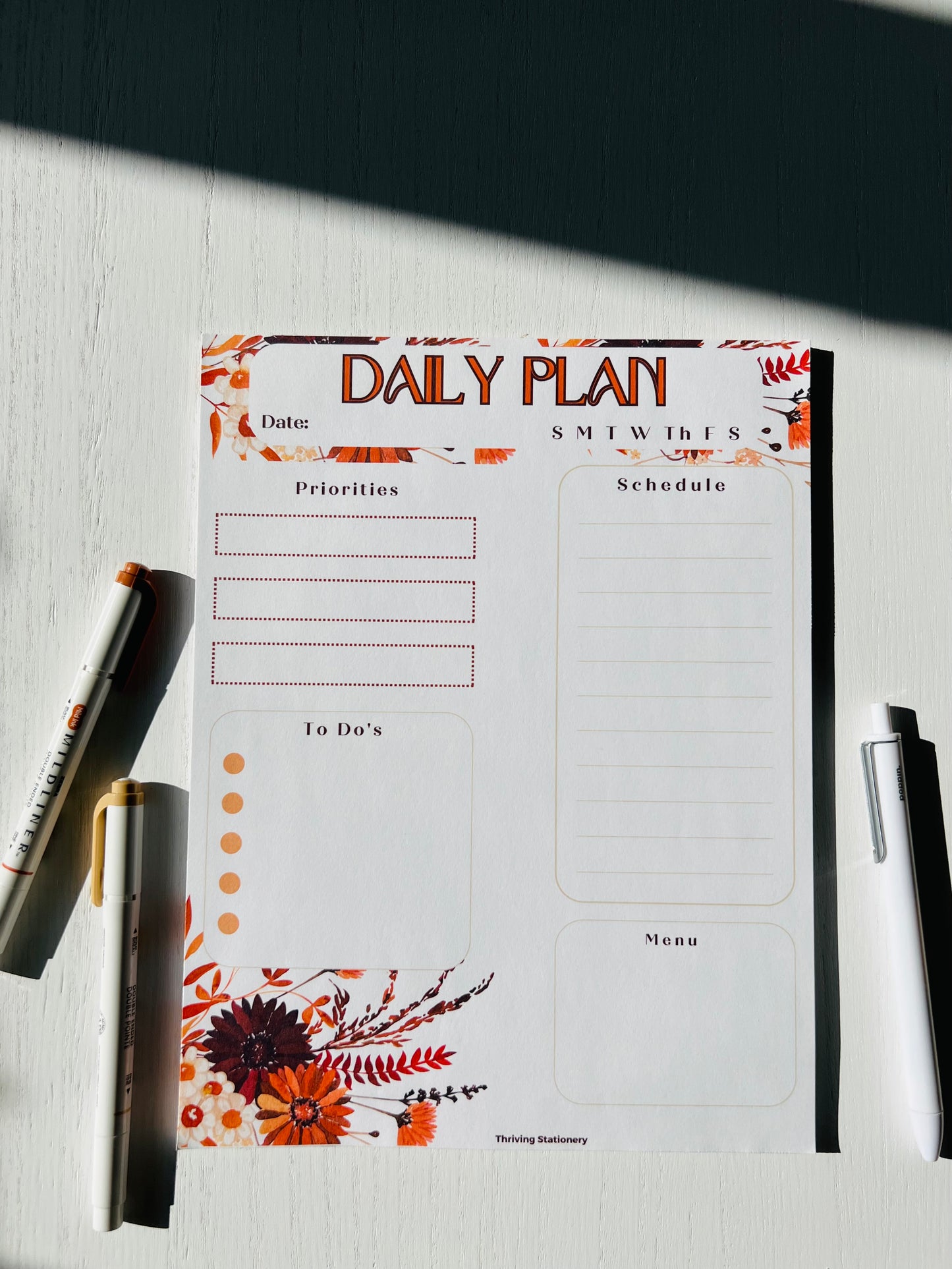 fall foliage daily planner, 31 pages on a desktop