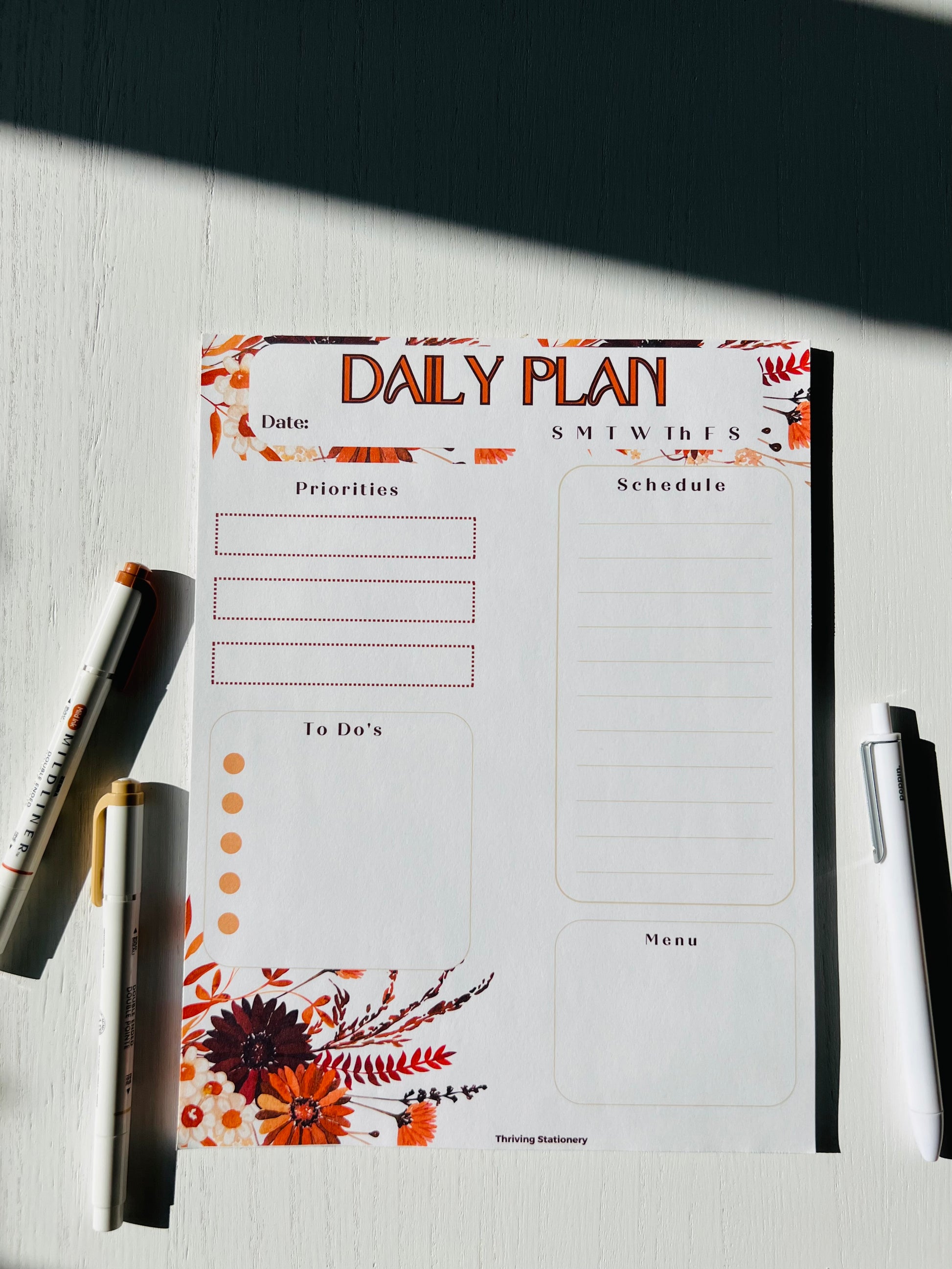 fall foliage daily planner, 31 pages on a desktop