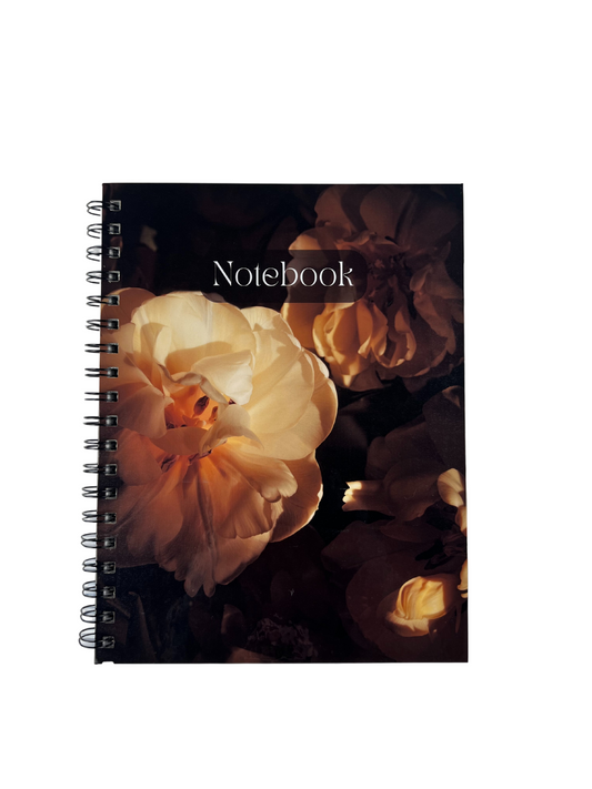 Notebook with floral design on a white background