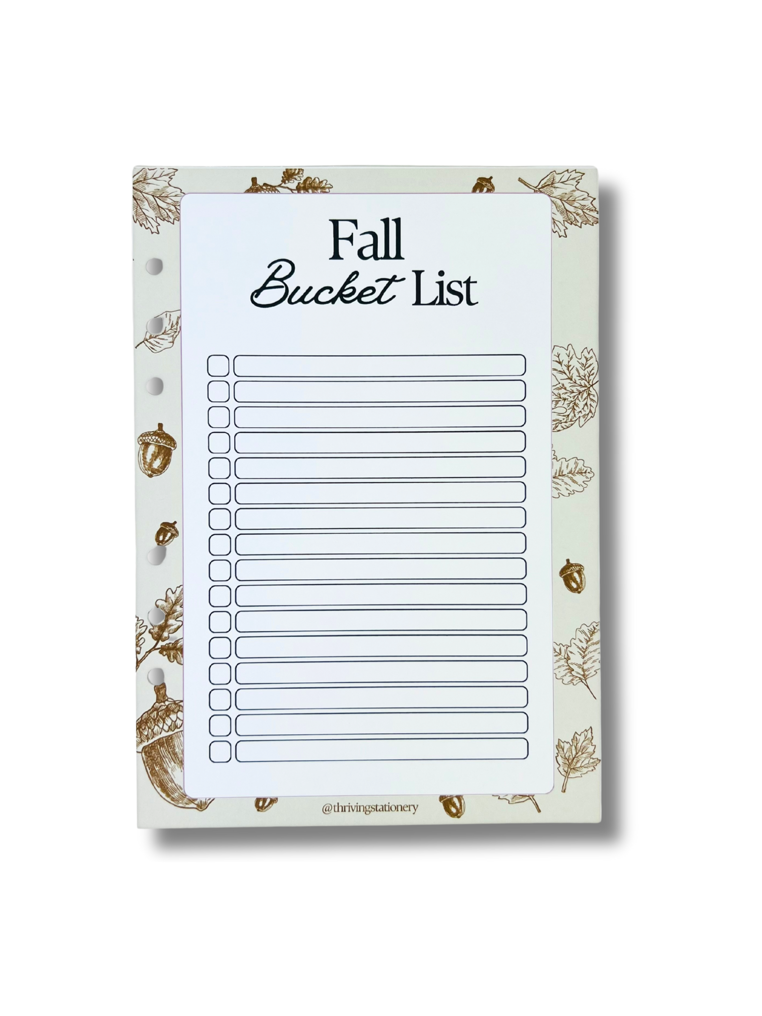 Notepad with 'Fall Bucket List' on a white background