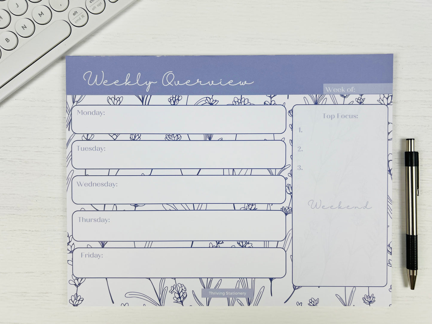 Purple Floral Weekly Planner Deskpad with soft floral design and weekly layout