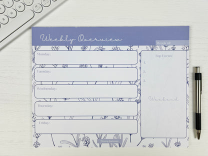 Purple Floral Weekly Planner Deskpad with soft floral design and weekly layout