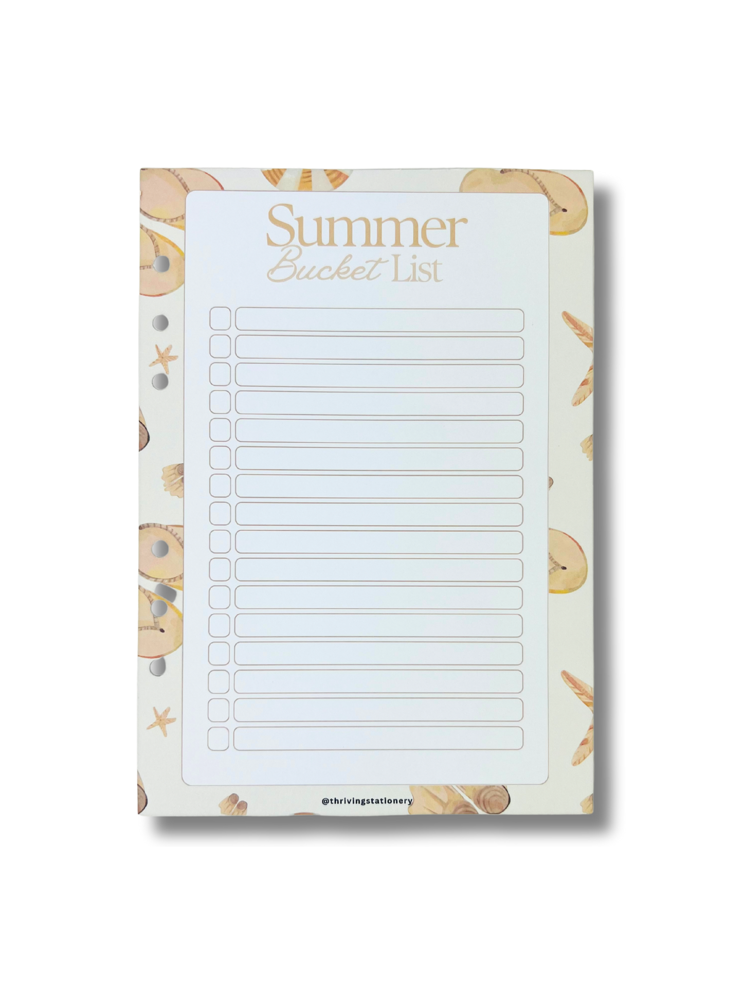 Notepad with 'Summer Bucket List' text and beach-themed border on a white background
