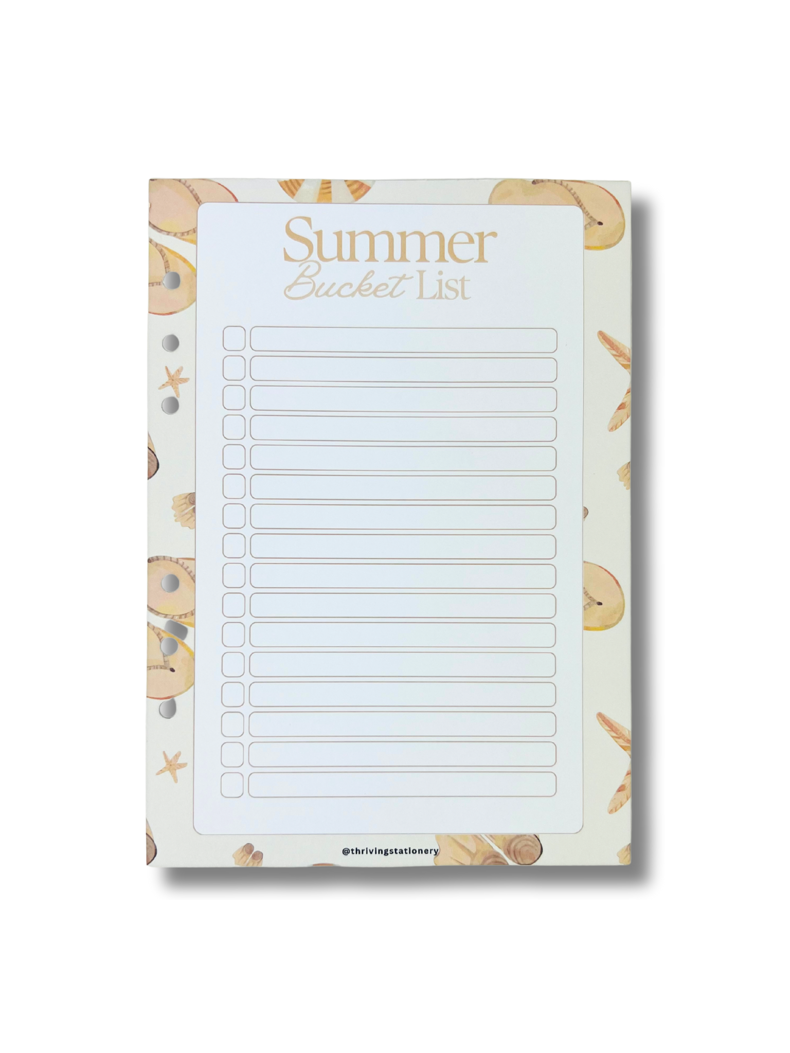 Notepad with 'Summer Bucket List' text and beach-themed border on a white background