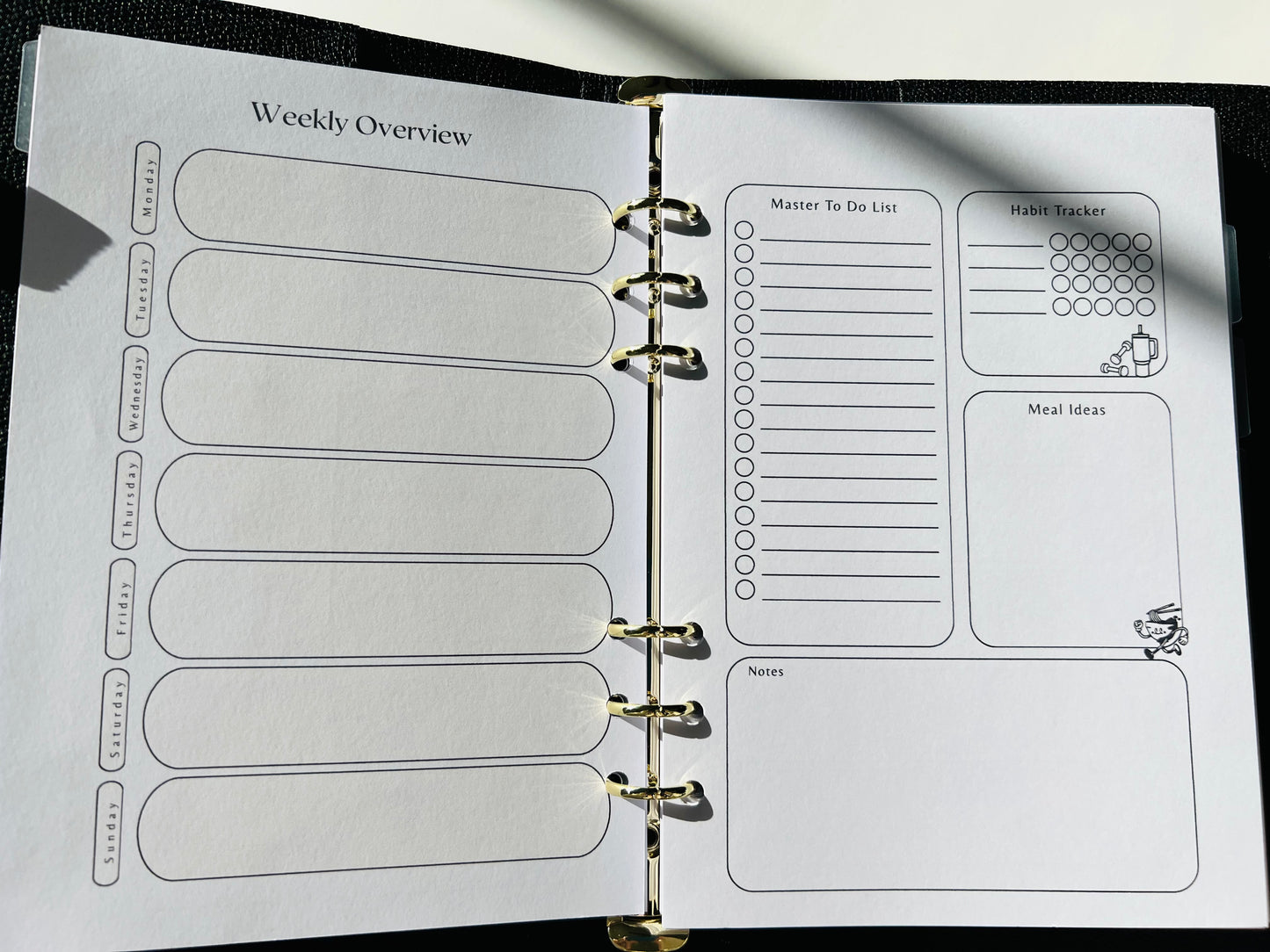 Planner with weekly overview and habit tracker pages.