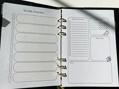 Planner with weekly overview and habit tracker pages.