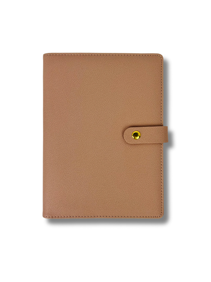 Brown leather planner cover with a yellow buckle on a white background