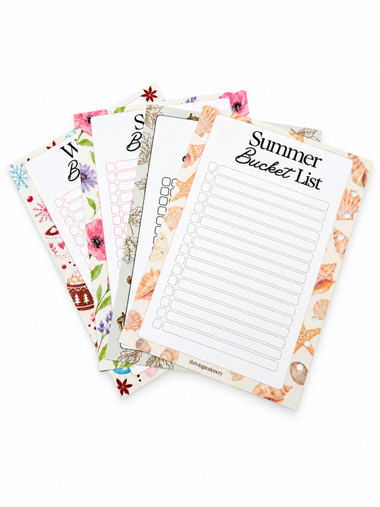 Four decorative printable list pads fanned out on a white background, including Summer Bucket List, 