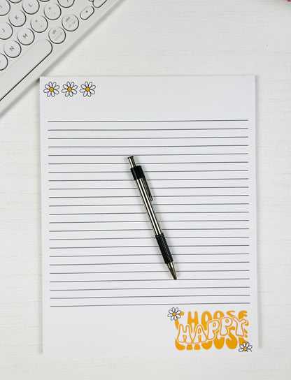 Choose Happy Large Lined Notepad with cheerful text design and lined pages with a pen for scale