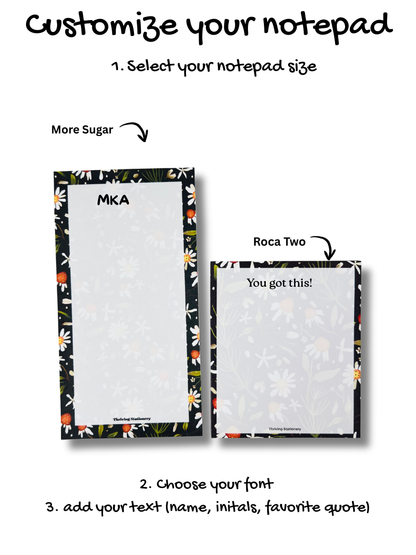 Two notepads with floral designs and text on a white background