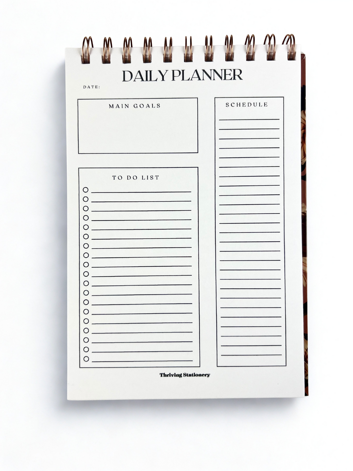 Daily planner with sections for main goals, schedule, to-do list, and date on a white background.