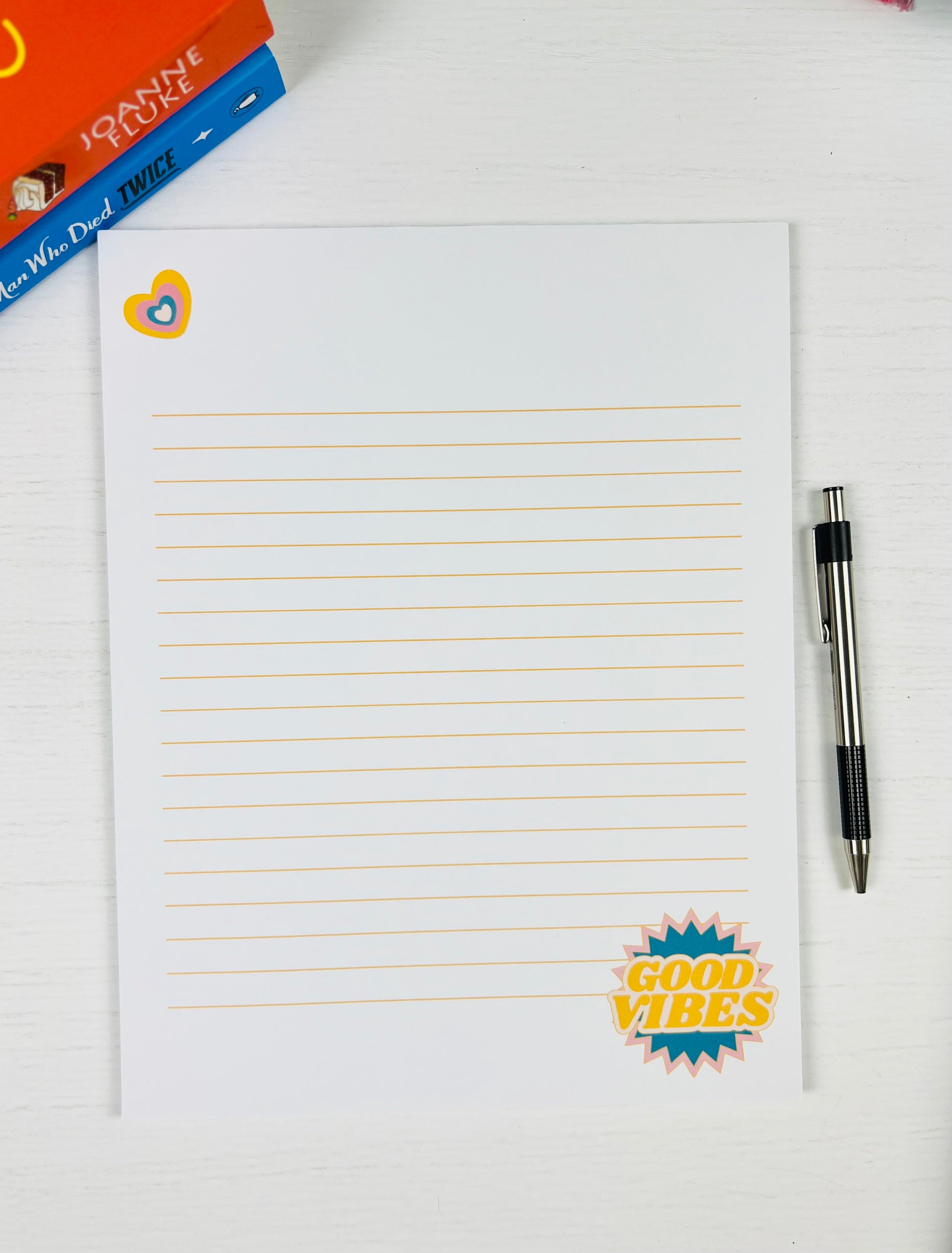 Good Vibes Large Lined Notepad with colorful text design and lined pages