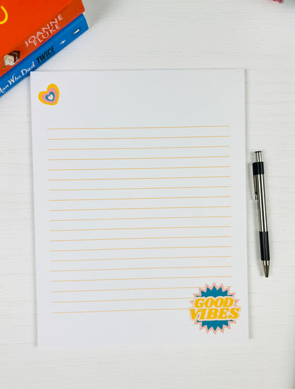 Good Vibes Large Lined Notepad with colorful text design and lined pages