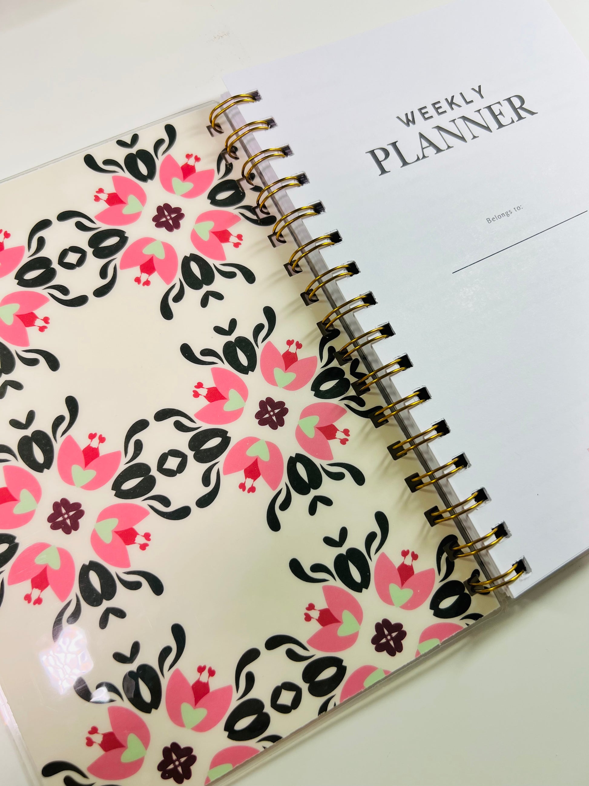Weekly planner with floral design on cover