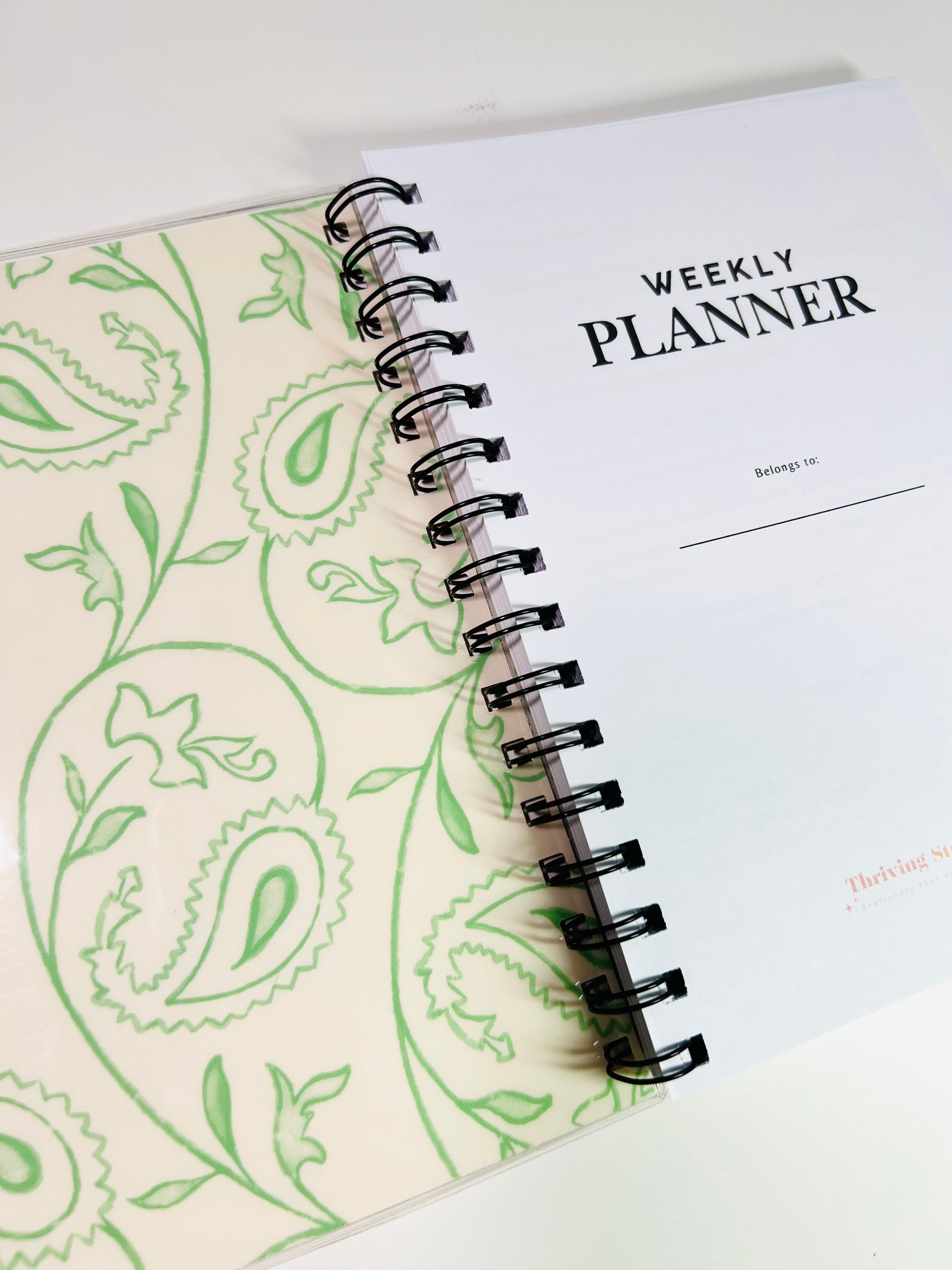 Weekly planner with paisley design on a white background