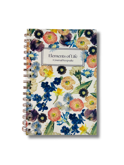 Floral notebook with 'Elements of Life' text on a white background