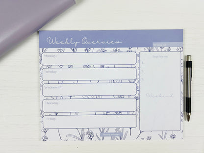 Purple Floral Weekly Planner Deskpad with soft floral design and weekly layout