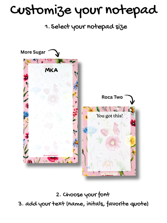 Two notepads with floral designs and text on a white background