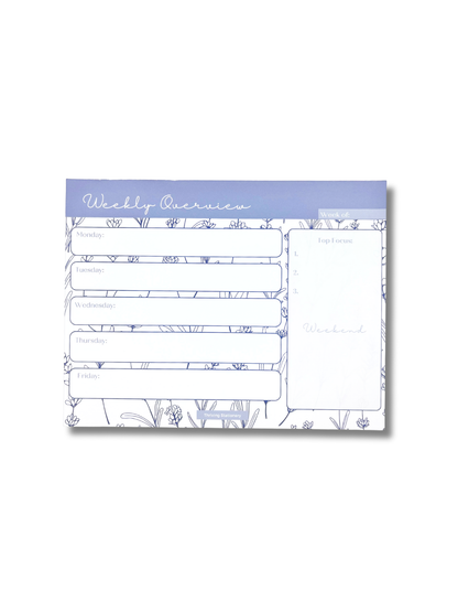 Weekly overview planner pad with floral design on a white background