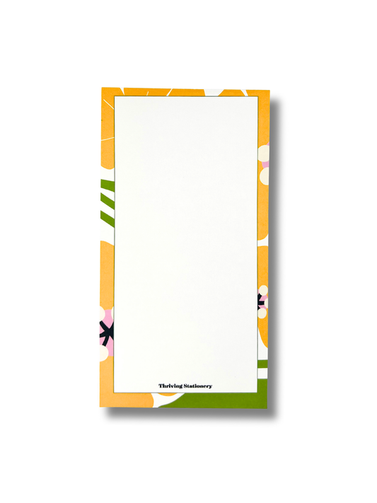 Notepad with colorful floral border on a white background
