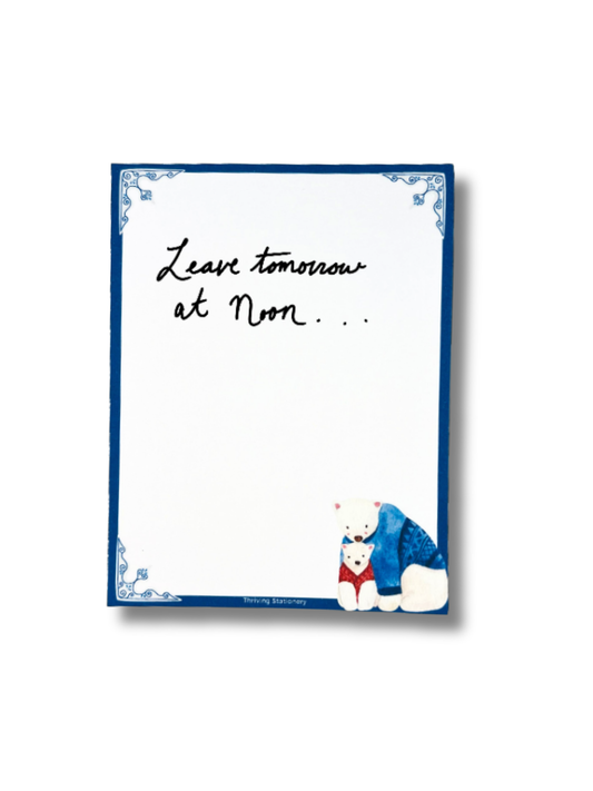 Notepad with a cartoon bear and text 'Leave tomorrow at Noon' on a white background