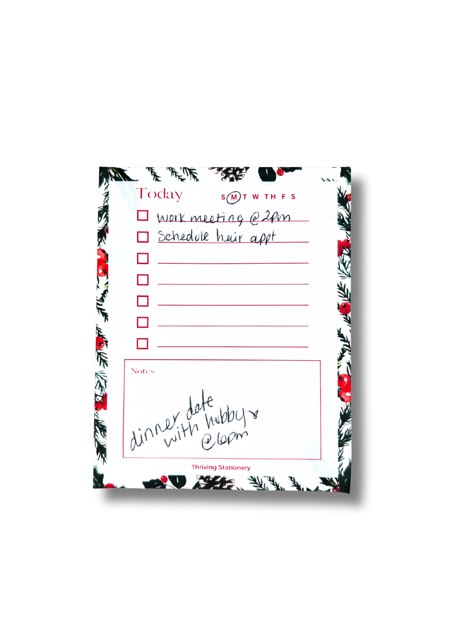 Notepad with a floral border and handwritten text on a white background