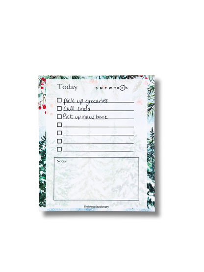 Notepad with a to-do list and floral border on a white background